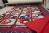A handmade quilt red, white and blue patriotic fabrics.