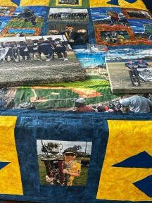 Blue & gold with baseball field and players and photos of championship games. Actual pictures of team and players.